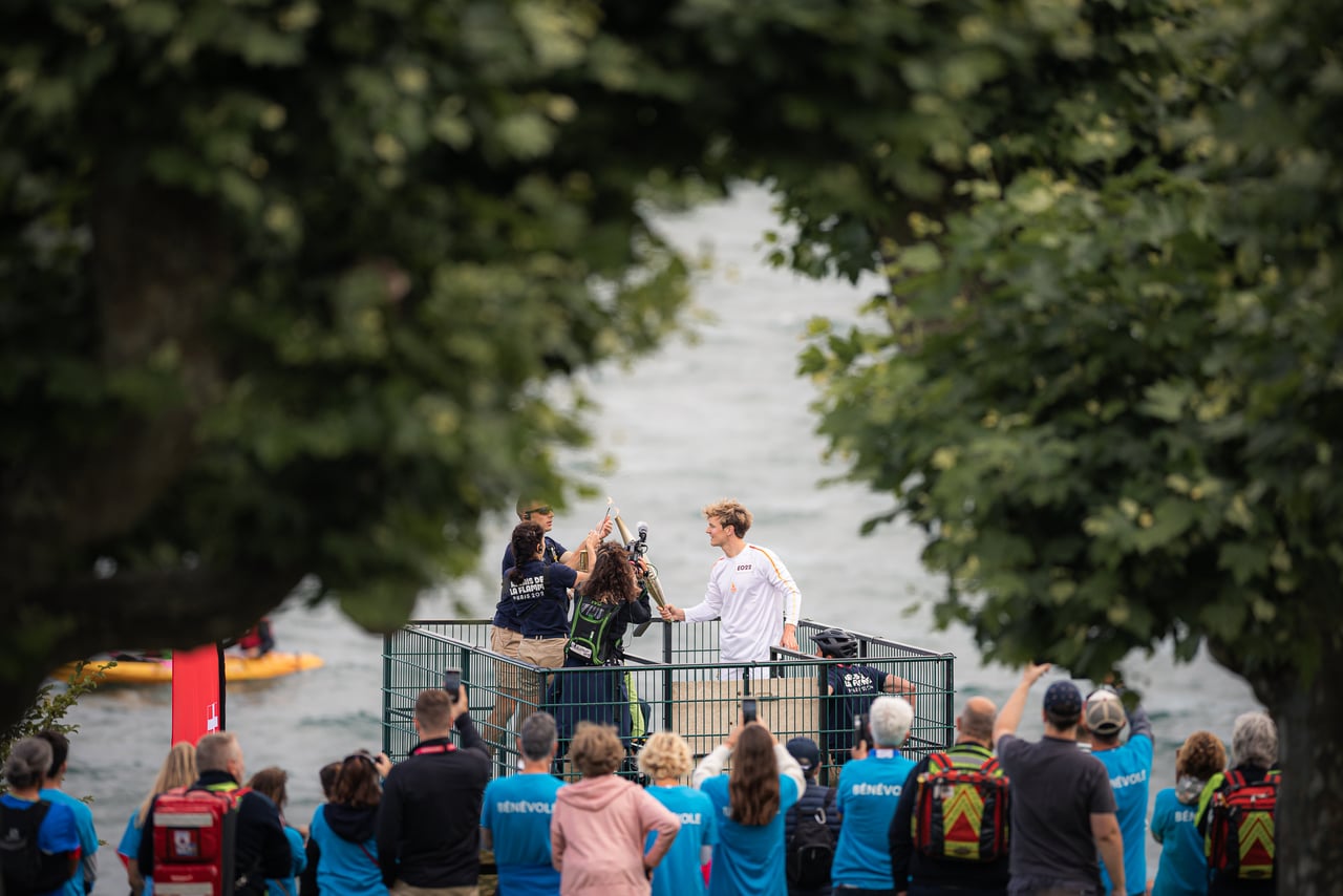 The crowd as the Olympic flame passes through Évian, 2024